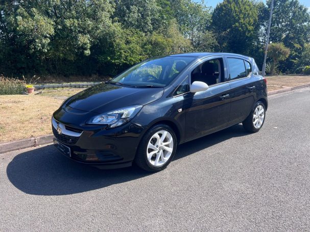 Black Vauxhall Corsa with white alloy wheels.