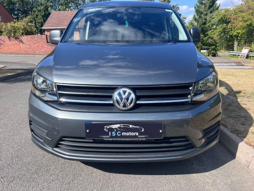 Front of a Grey Volkswagon Caddy van.